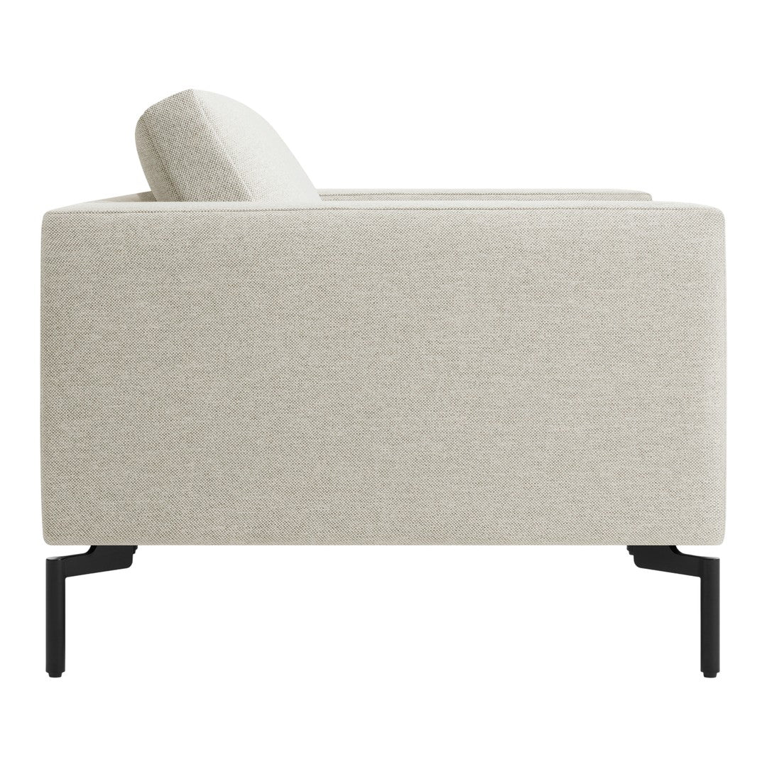 Light beige fabric sofa with subtle texture, complemented by sleek black metal legs. Modern and minimalist design.