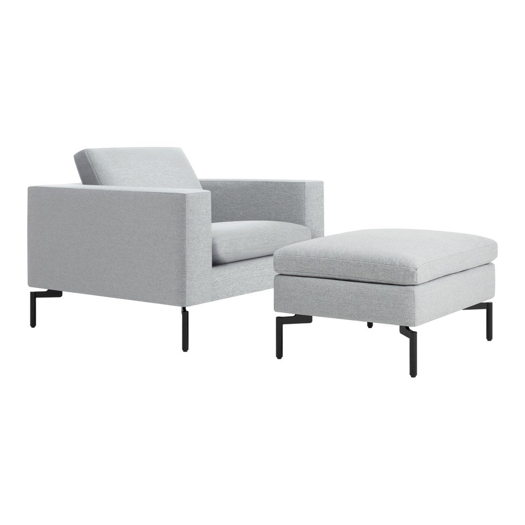 Light gray modern armchair and ottoman with a textured finish and sleek black metal legs.