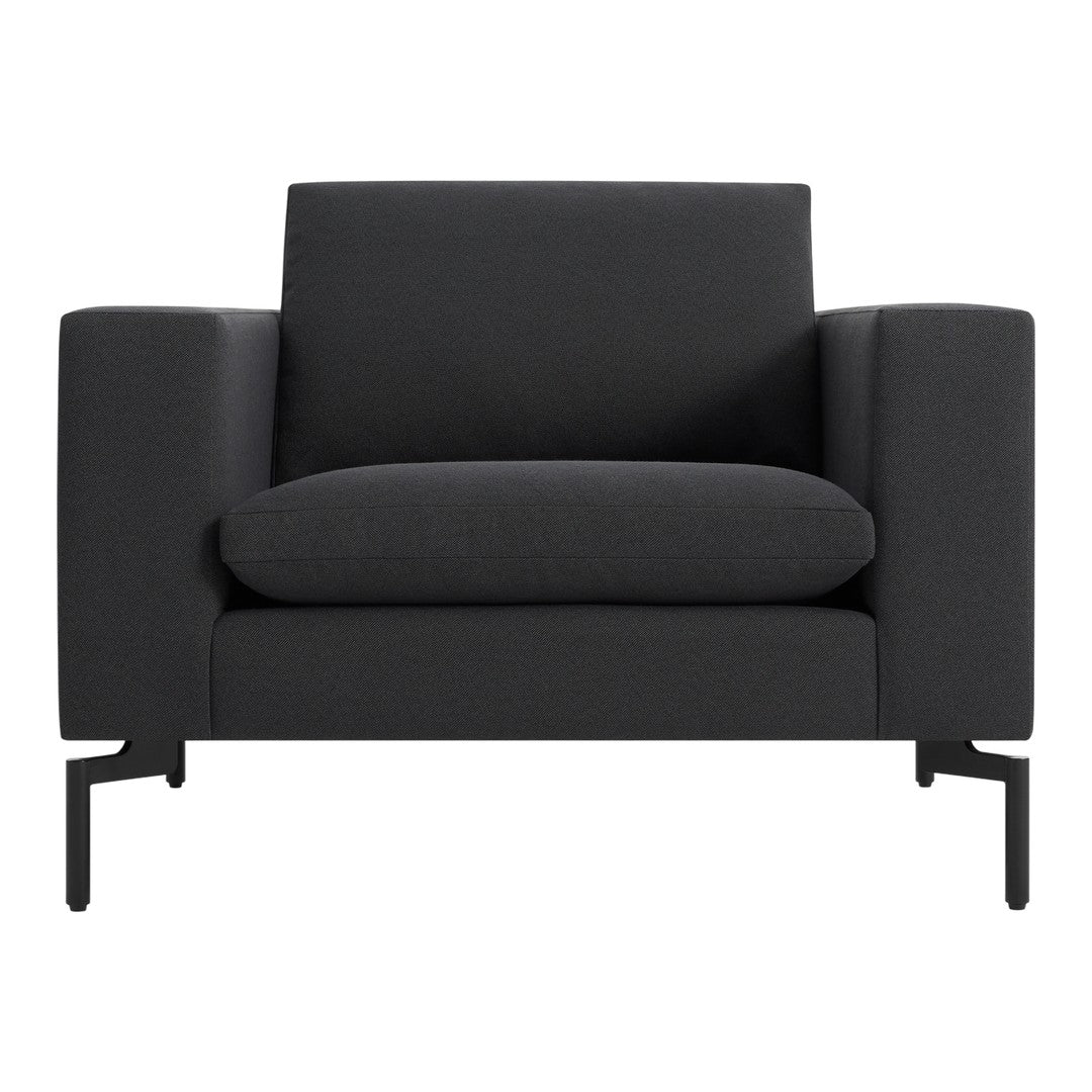 Stylish, modern armchair in solid black with a sleek, textured finish and minimalist metal legs.