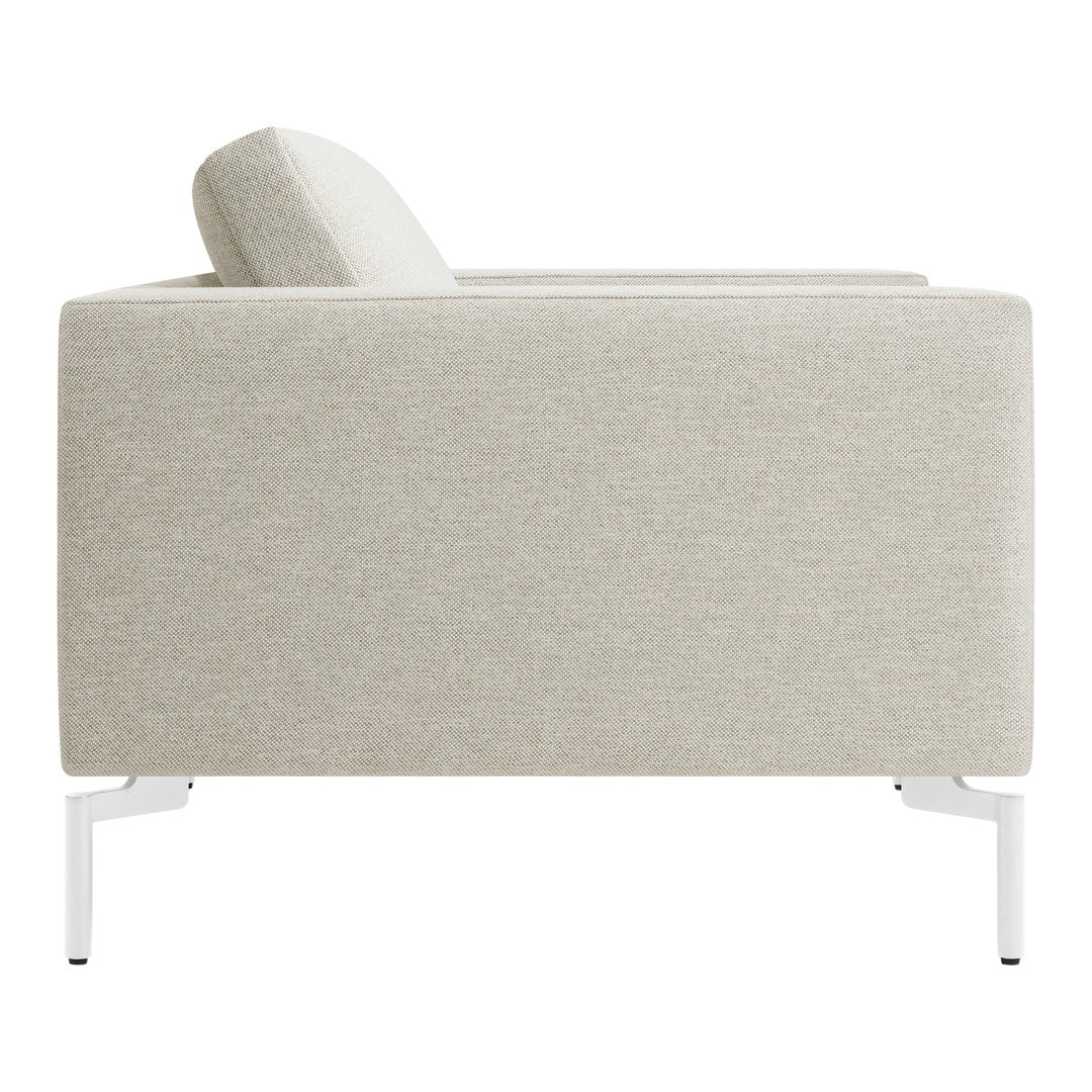 Light beige upholstered sofa with a subtle textured pattern, featuring sleek white legs. Perfect modern decor accent.