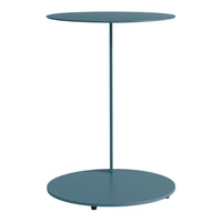 Round teal side table with a minimalist design and smooth, solid finish. Ideal for modern decor aesthetics.