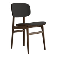 Modern black chair with a sleek, curved design and dark wood legs. Minimalist style fits any decor.