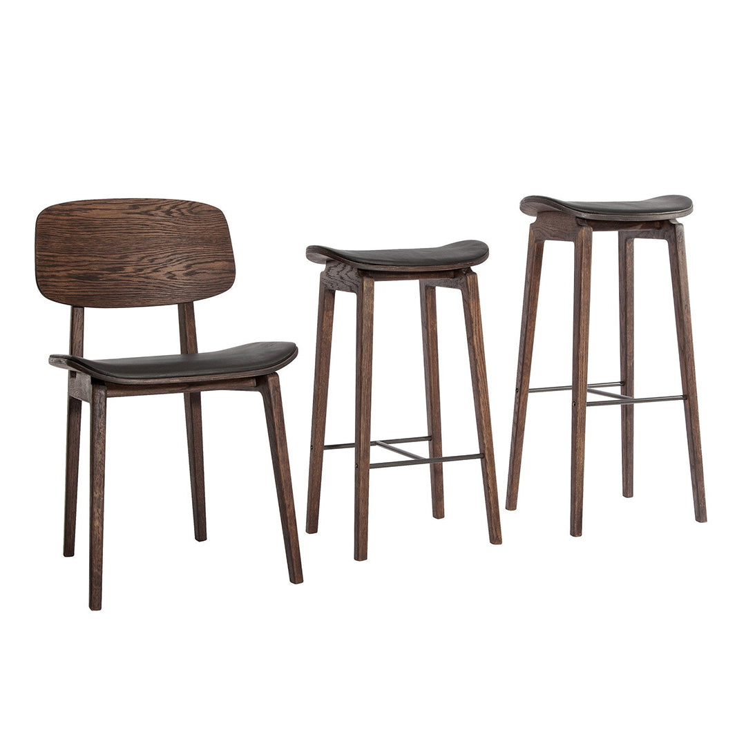 Set of three bar stools in dark wood with smooth black seats, showcasing a sleek, modern design.