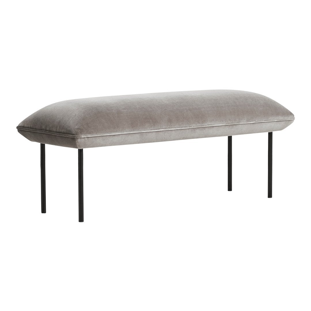 Gray velvet bench with a smooth, plush surface and sleek black metal legs, perfect for modern decor.