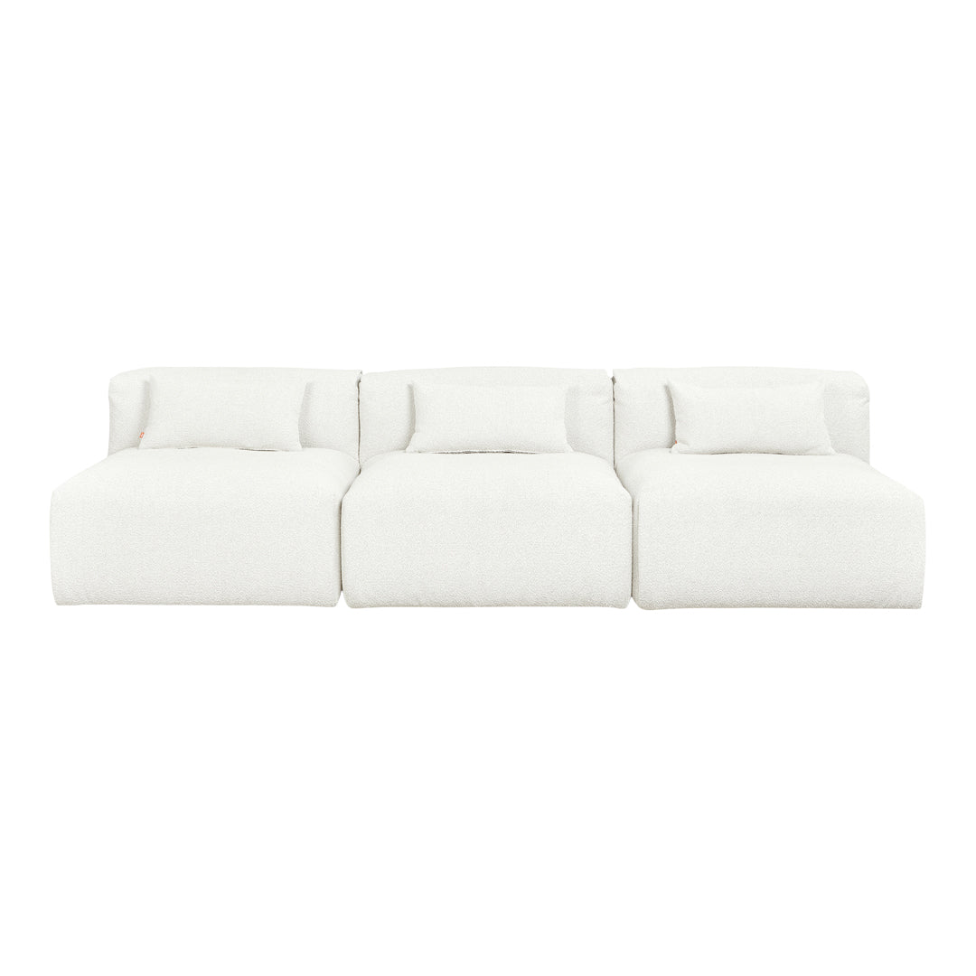 White, plush three-section sofa with soft textured fabric and matching cushions, perfect for a modern living space.