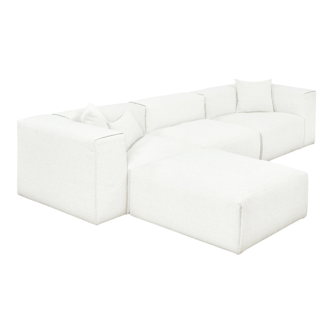 Textured white modular sofa with clean lines and minimalistic design, featuring matching white throw pillows.