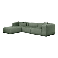 Lush green sectional sofa with textured fabric and matching cushions for a cozy, modern aesthetic.