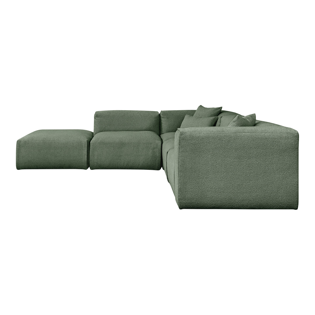 Soft green modular sofa with textured fabric and plush cushions, ideal for modern living spaces.
