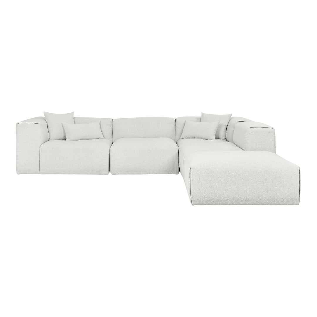 Cozy white sectional sofa with soft, textured fabric and contrasting black stitching, perfect for modern living spaces.