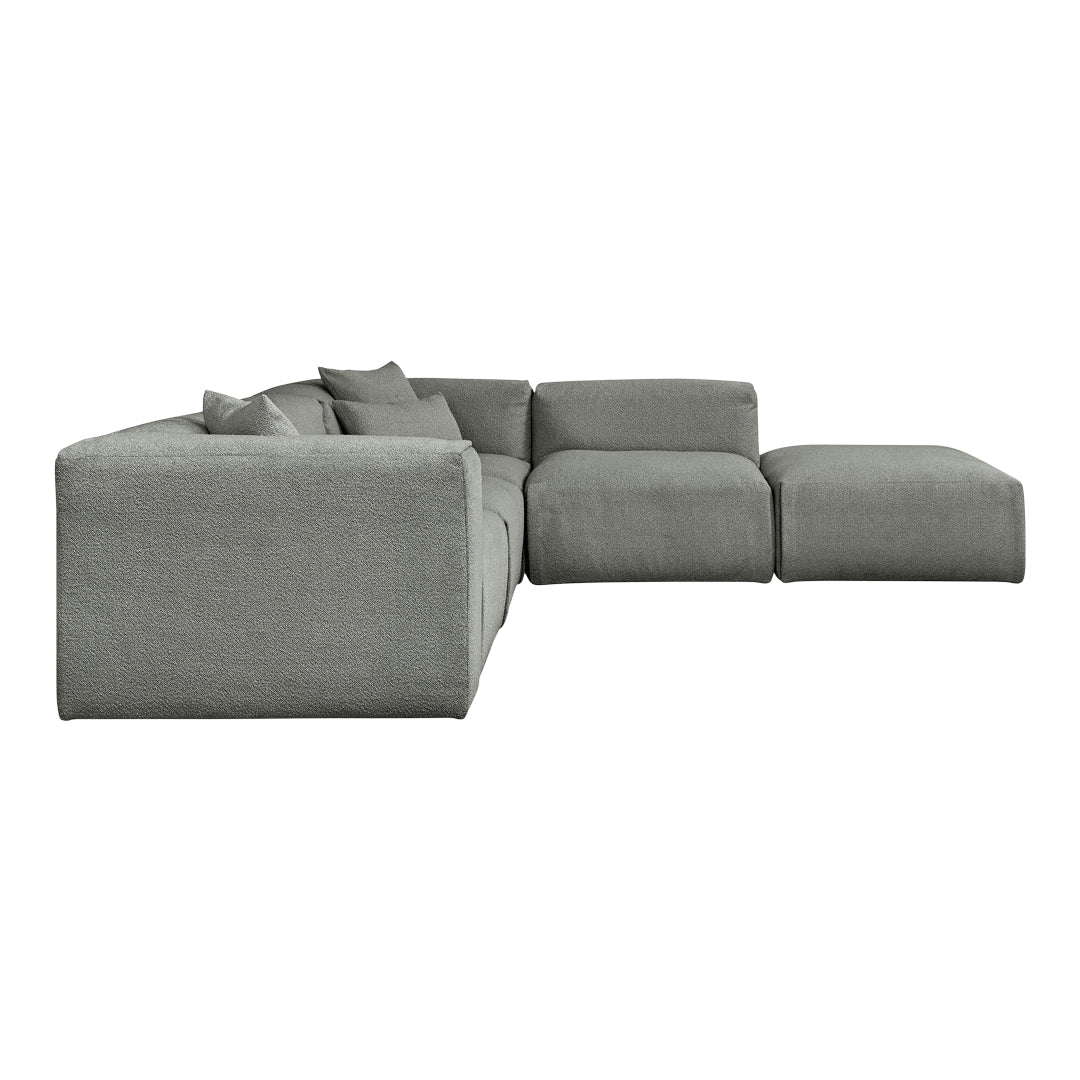"Modern grey sectional sofa with soft, textured fabric and minimalist design, featuring plush accent pillows."