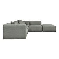 "Modern grey sectional sofa with soft, textured fabric and minimalist design, featuring plush accent pillows."
