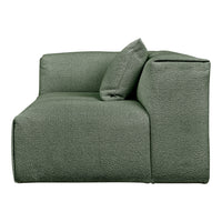 Stylish green sofa with a textured pattern and a matching pillow, perfect for modern living spaces.