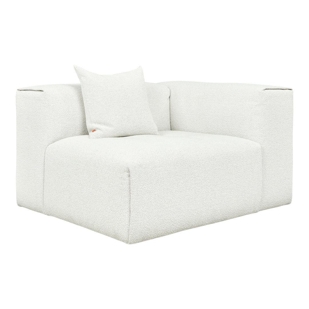 Cozy white oversized armchair with subtle textured fabric and matching pillow, perfect for modern decor.