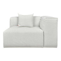 Textured cream-colored sofa with a subtle pattern, including a matching pillow for added comfort.