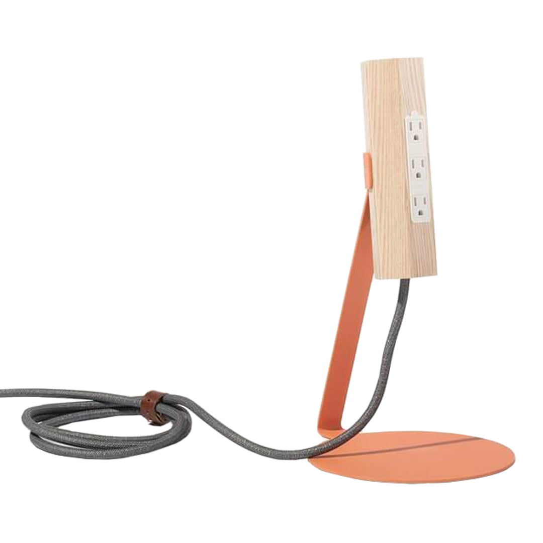 Wooden lamp with a sleek orange base and gray fabric cord, showcasing a modern, minimalist design.
