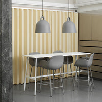 Modern dining set with gray chairs and pendant lights, complemented by soft beige curtains and sleek white table.