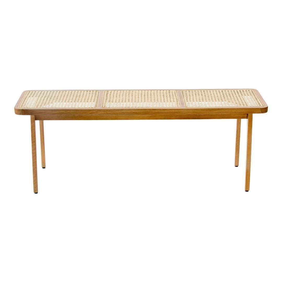 Wooden bench with a natural bamboo finish and woven cane pattern on top. Ideal for modern or bohemian decor.