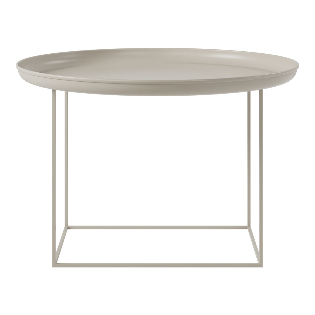 Round beige tray table with a minimalist white metal base, featuring a smooth, solid surface for modern decor.