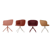 Set of four stylish chairs in muted peach, terracotta, deep burgundy, and warm brown with sleek bases in contrasting colors.