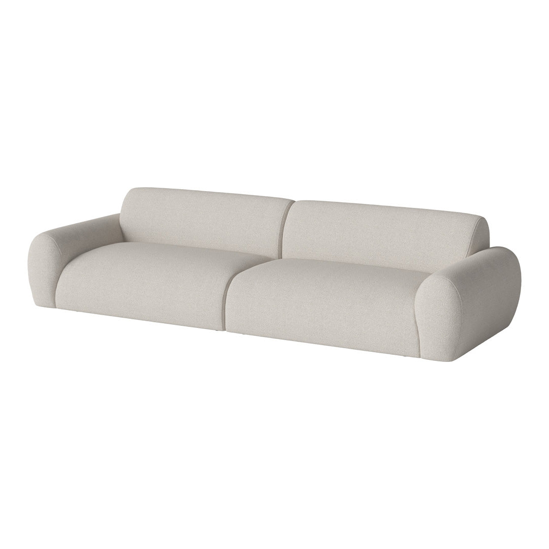 Modern light beige sofa with smooth, textured fabric and rounded armrests, perfect for minimalist decor.