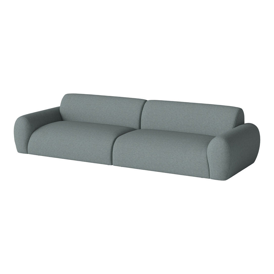 Soft grey upholstered sofa with a modern, minimalist design and rounded arms, perfect for contemporary living spaces.