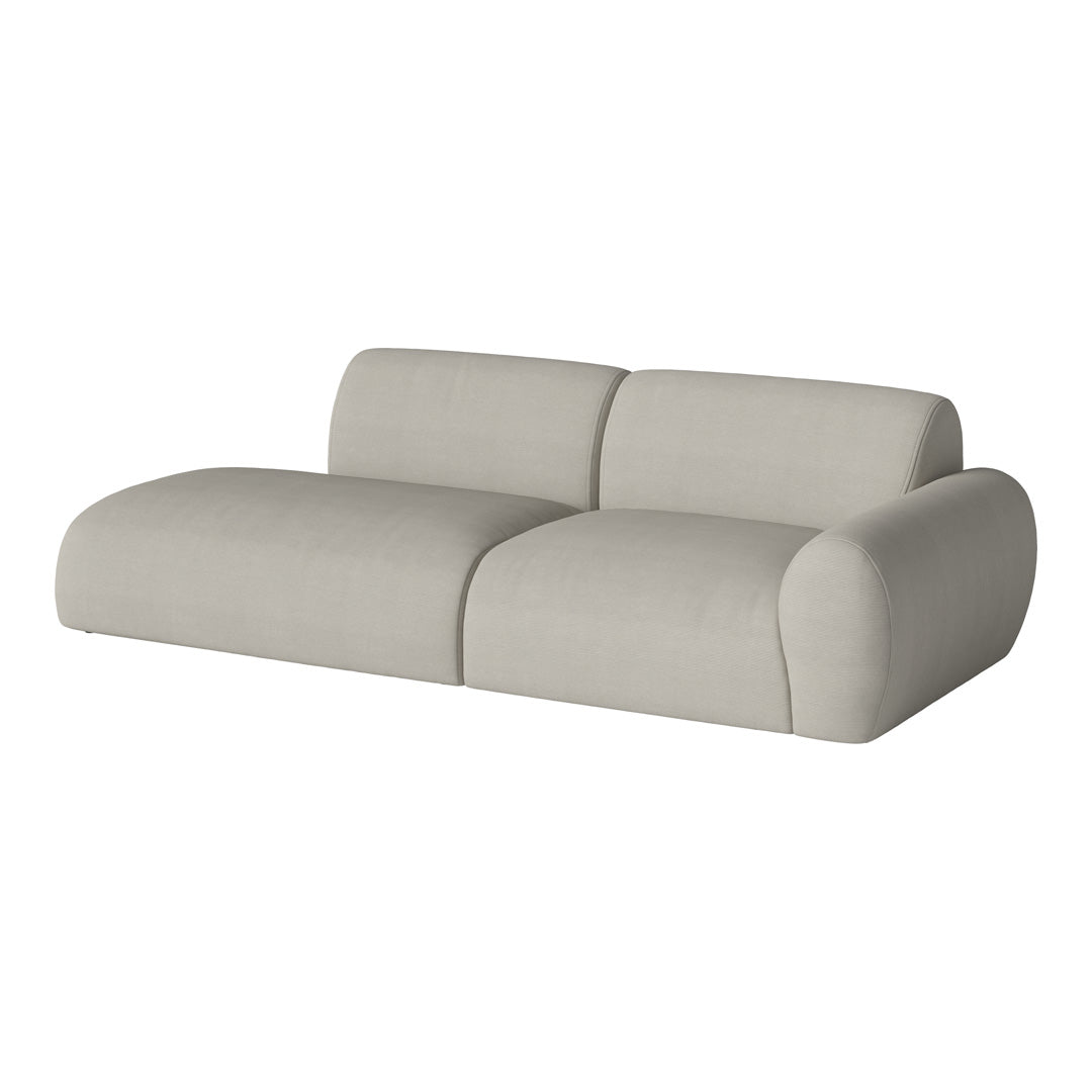 Minimalist beige sofa with smooth, rounded edges and a soft, textured fabric finish. Perfect for modern living spaces.