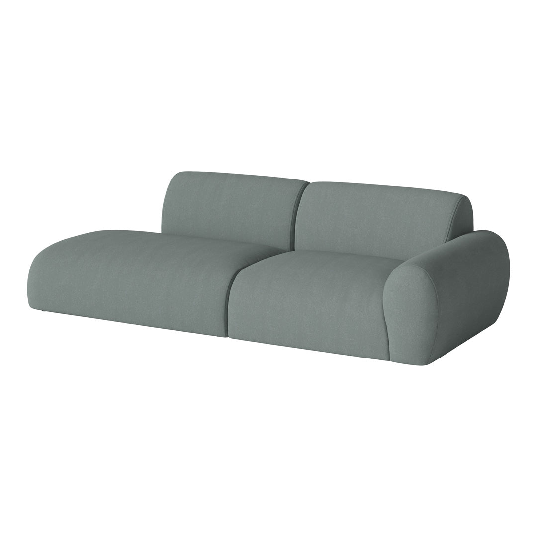 Soft, muted teal sofa with a smooth, minimalist design and rounded edges, perfect for modern interiors.