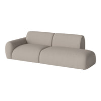 Sleek beige sofa with smooth, curved lines and a soft-textured fabric, perfect for modern interiors.