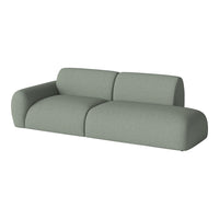 Soft green modular sofa with a modern, minimalist design and textured fabric upholstery. Perfect for stylish living spaces.