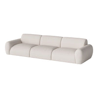 Contemporary white sofa with smooth, rounded curves and a minimalist design, perfect for modern interiors.