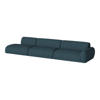 Teal modern sofa with smooth upholstery and rounded edges, featuring a solid color and subtle texture.