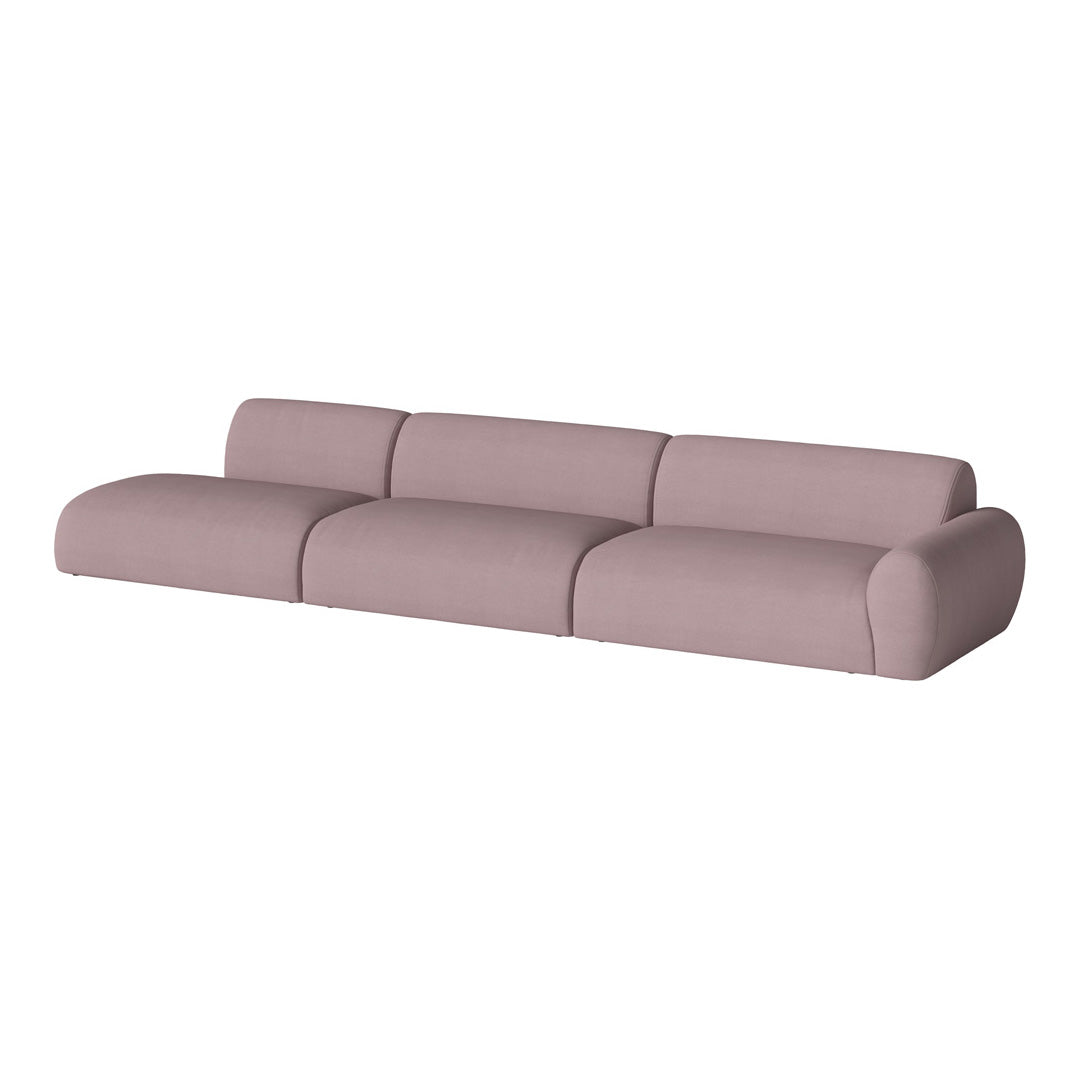 Soft pink modern sofa with smooth, rounded edges, designed for contemporary living spaces.