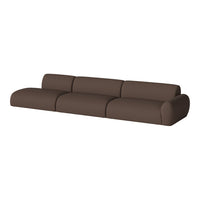 Brown modular sofa with a smooth, seamless design and soft, textured fabric for a contemporary look.