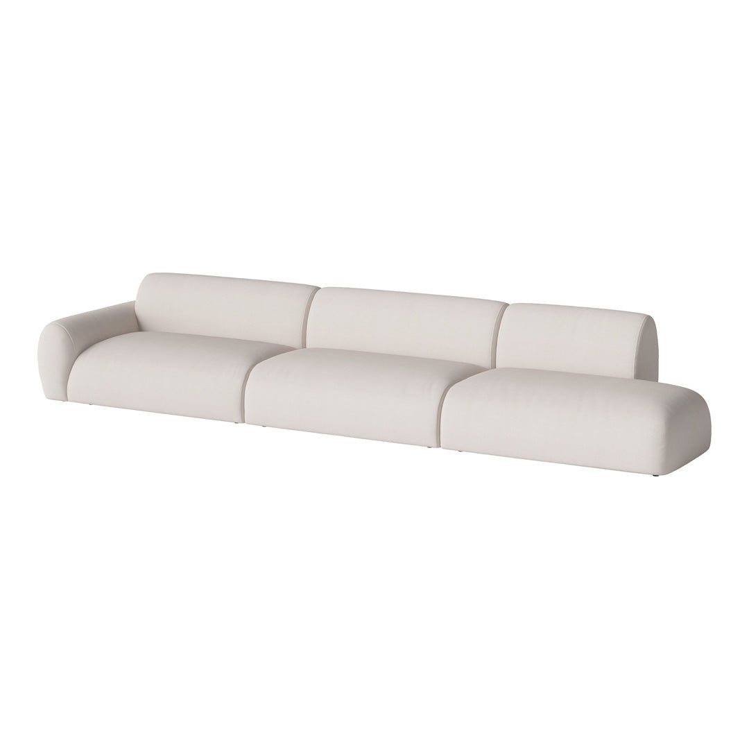 Modern white modular sofa with soft, smooth upholstery and rounded edges, perfect for minimalist interiors.