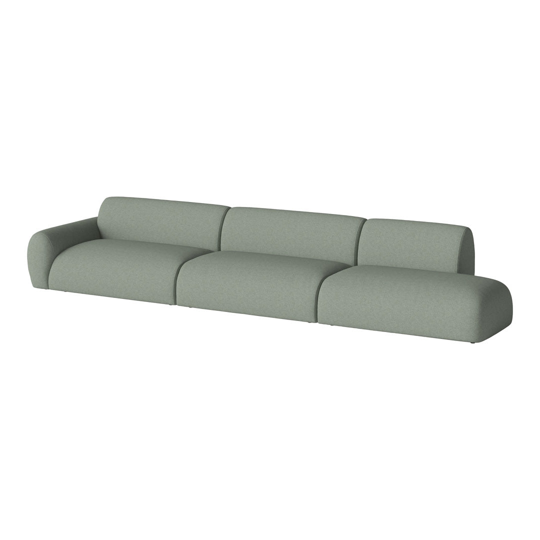 Contemporary green modular sofa with smooth, curved lines and a textured fabric finish. Perfect for modern living spaces.