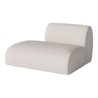 Neutral beige chaise lounge with a smooth, minimalist design and subtle ribbed texture. Perfect for modern interiors.