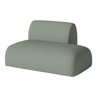Green upholstered sofa with a smooth, curved design and minimalist style. Perfect for modern interiors.
