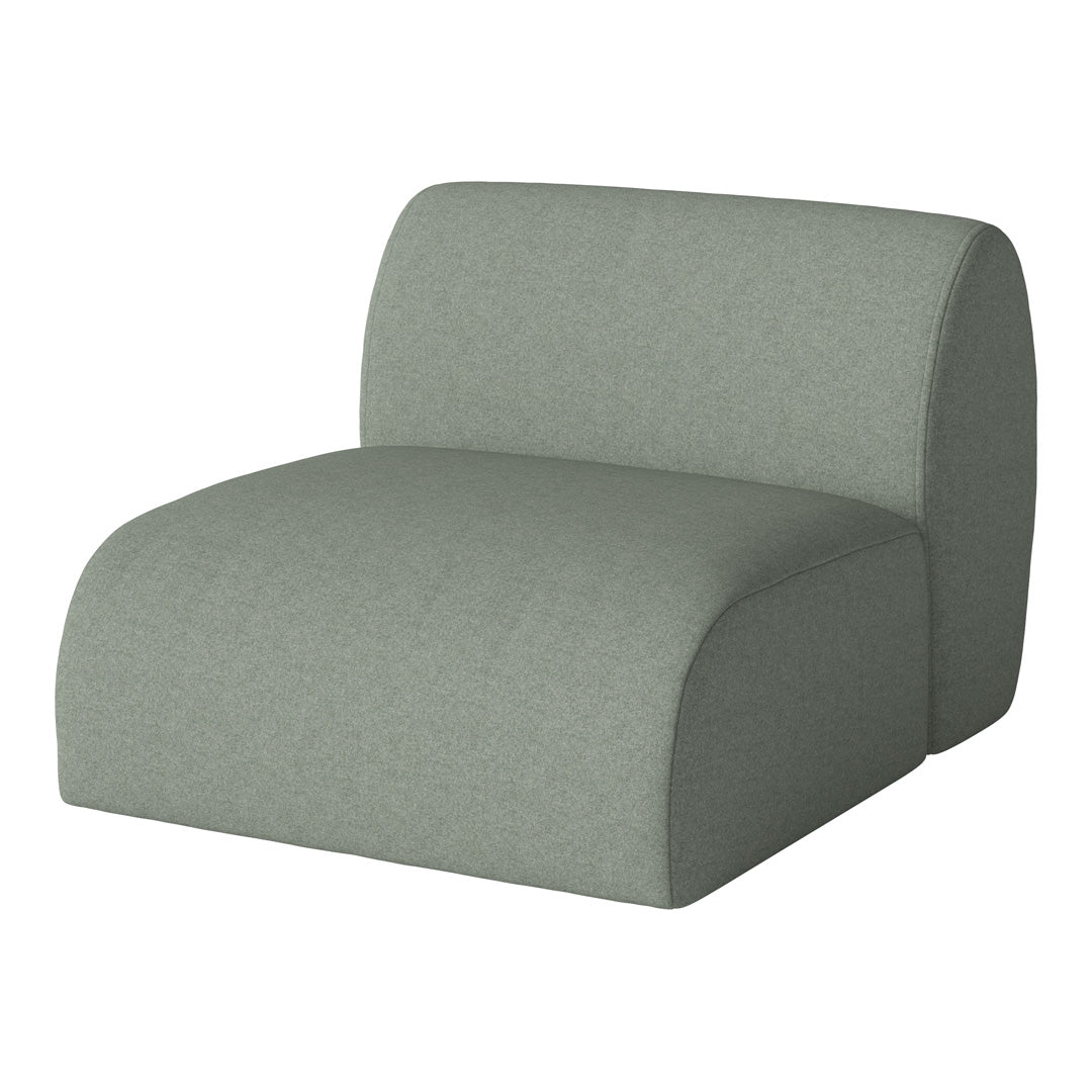 Green modular chair with a soft, textured fabric and smooth, rounded edges, perfect for modern interiors.