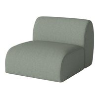 Green modular chair with a soft, textured fabric and smooth, rounded edges, perfect for modern interiors.