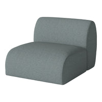 Soft grey upholstered chair with a smooth, modern design, featuring subtle texture and rounded edges.