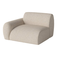 Beige modern chair with a soft textured fabric and rounded design, perfect for cozy living spaces.