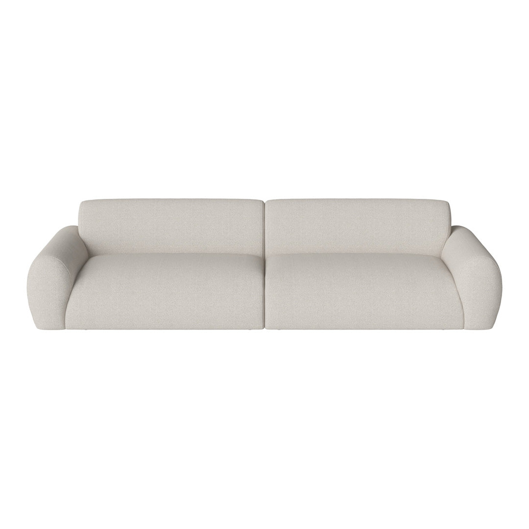 Light beige sofa with a smooth, textured fabric and rounded arms, perfect for neutral-toned interiors.