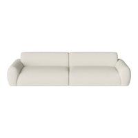 Cream-colored, minimalist two-seater sofa with smooth, textured upholstery and rounded armrests. Modern style.