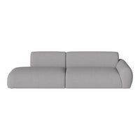 Sleek modern sofa in soft light gray fabric, featuring a minimalist design and smooth, curved lines for a contemporary look.