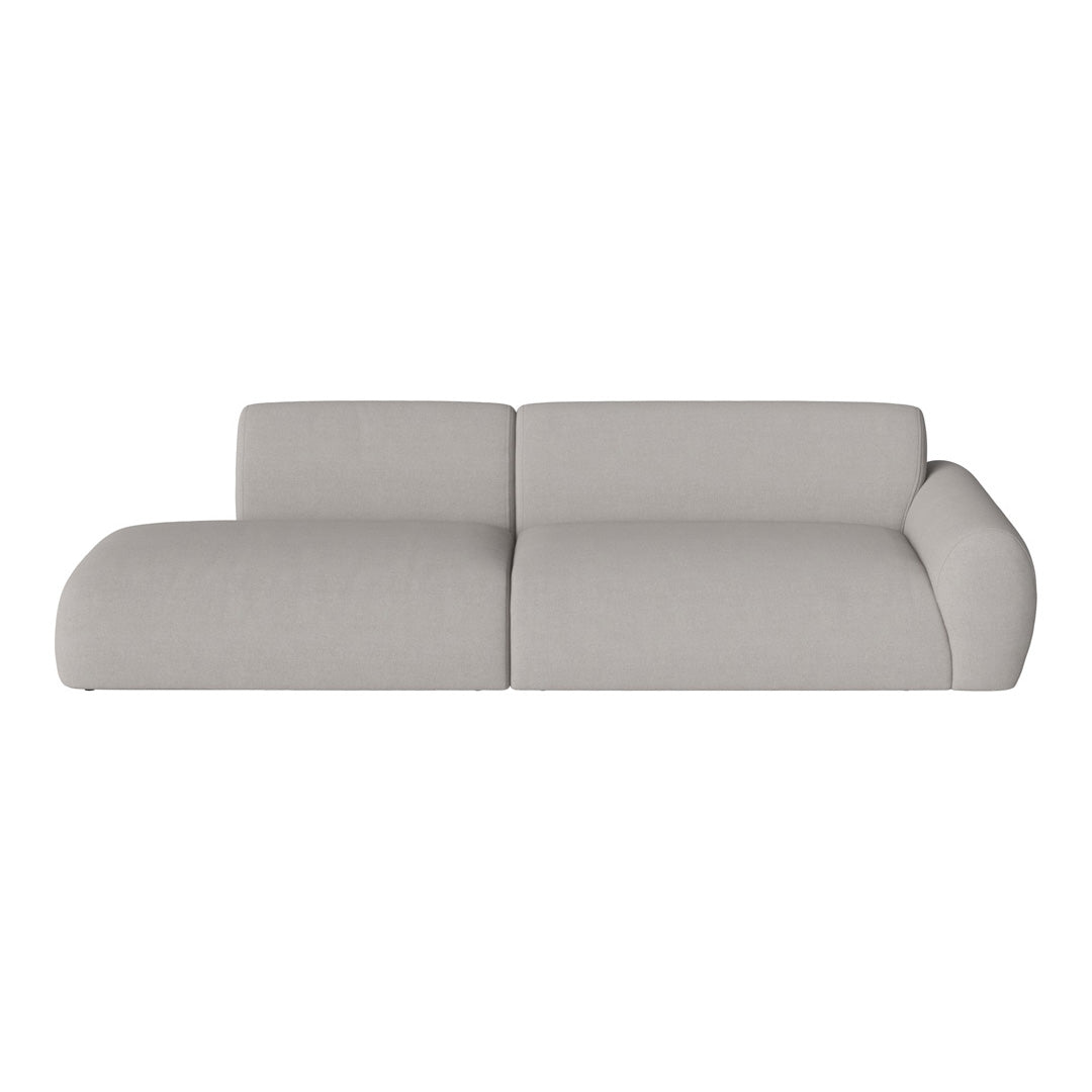 Light gray sectional sofa with smooth, modern upholstery and minimalistic design.