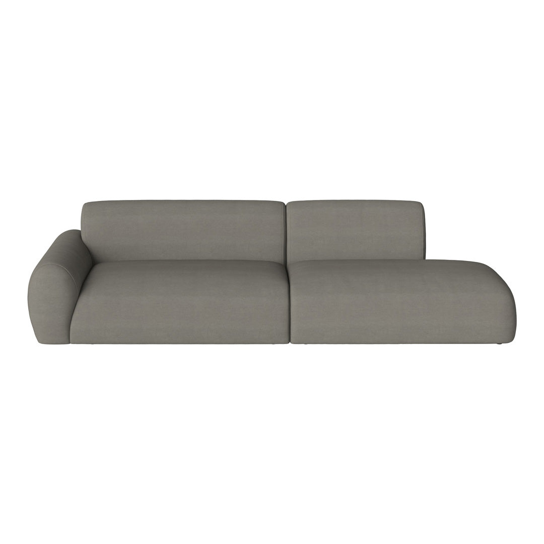 Gray upholstered modern sectional sofa with a sleek, minimalist design and soft texture.