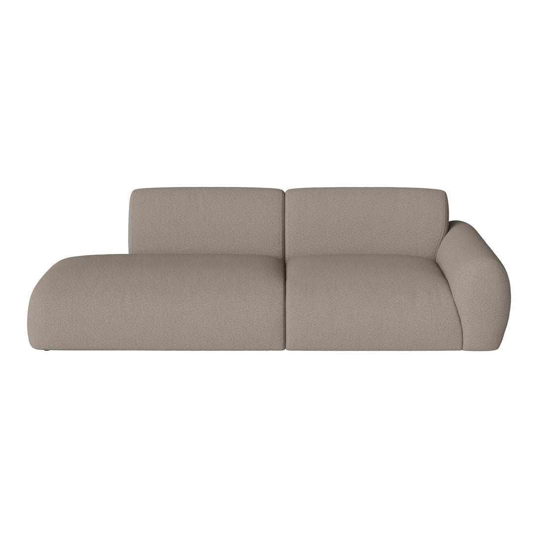 Beige sofa with a soft, textured fabric and contemporary, curved design. Perfect for modern living spaces.
