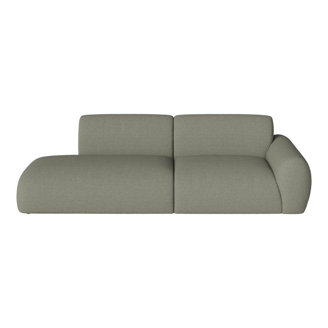 Light olive green sofa with a smooth, textured fabric and modern, curved design, perfect for contemporary spaces.