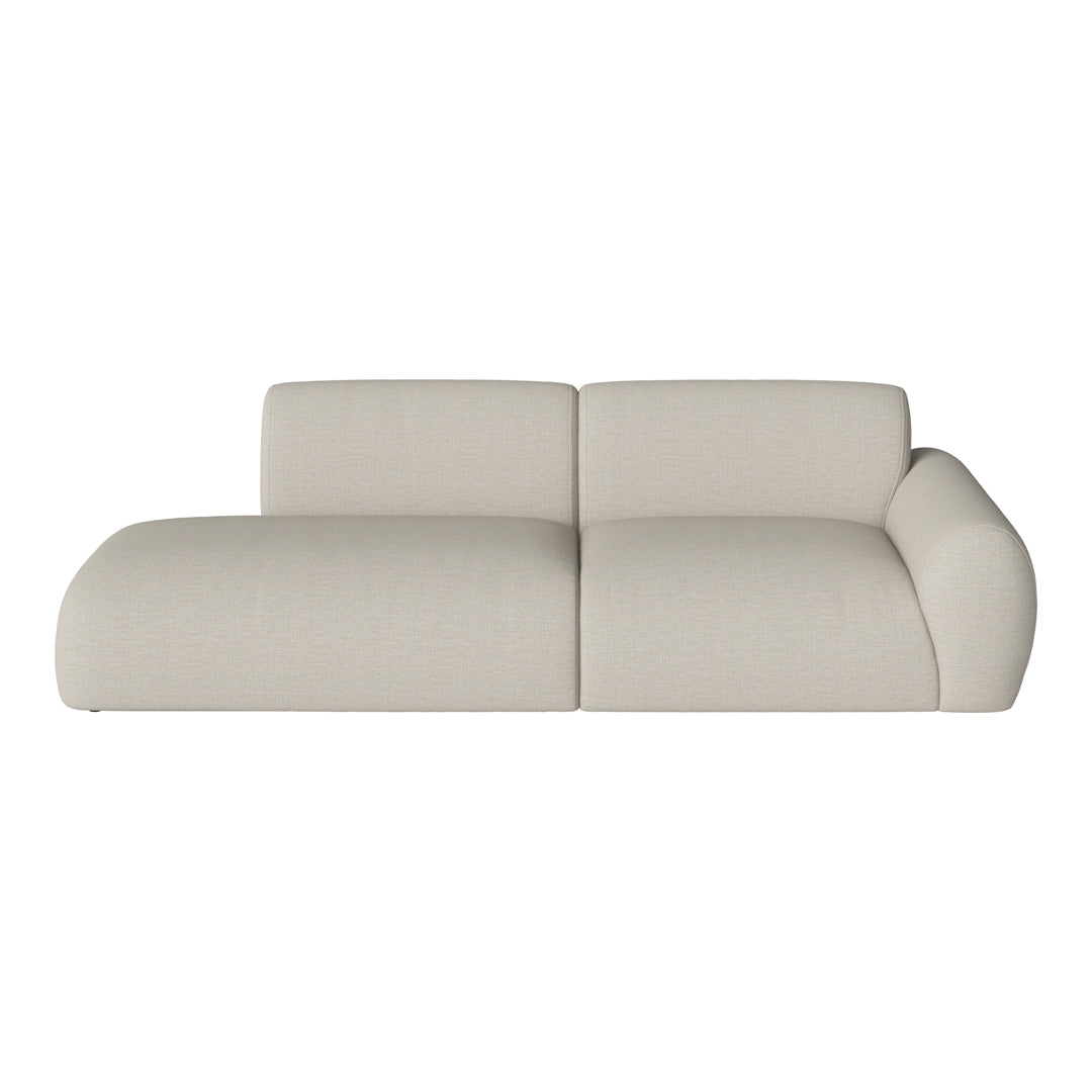 Modern beige sofa with soft, textured fabric and a curved design, perfect for stylish living spaces.