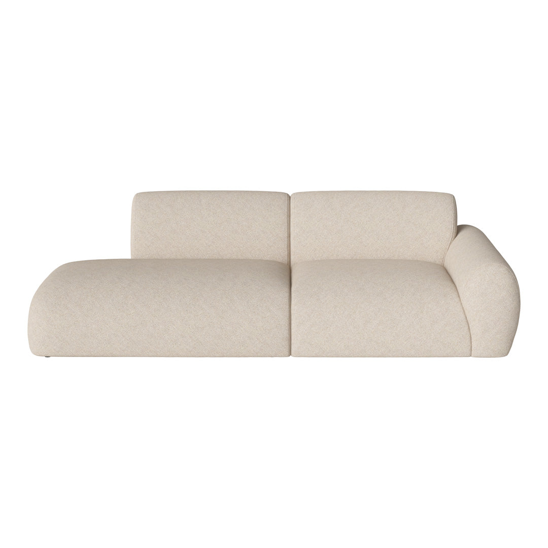Cream-colored, textured sofa with soft curves, featuring subtle flecks for a modern, minimalist look.